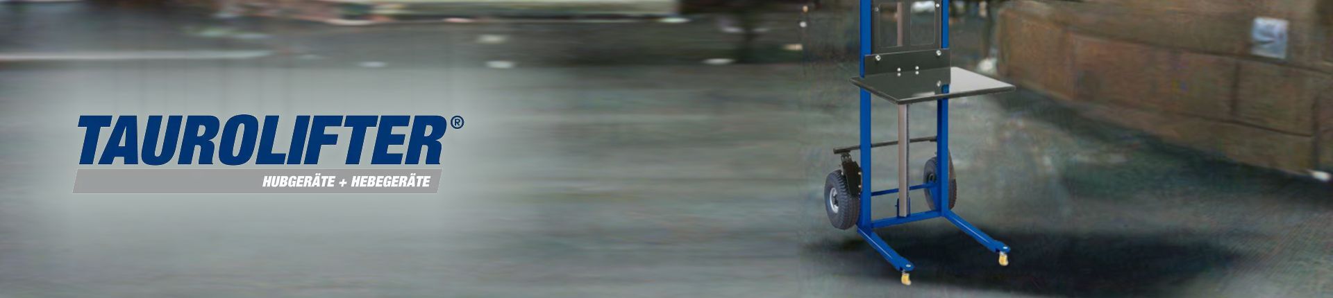 Blauer Taurolifter Handhubwagen in einem Lager stehend Blauer Taurolifter Handhubwagen in einem Lager stehend